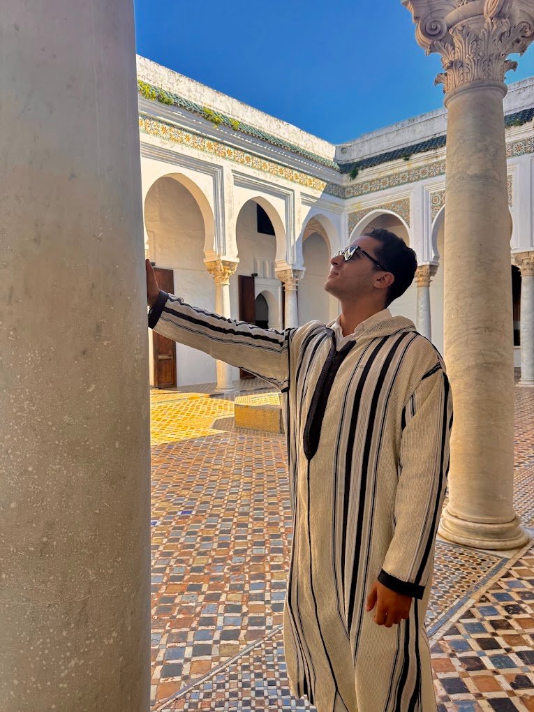 Licensed Tangier tour guide in a traditional Moroccan riad courtyard