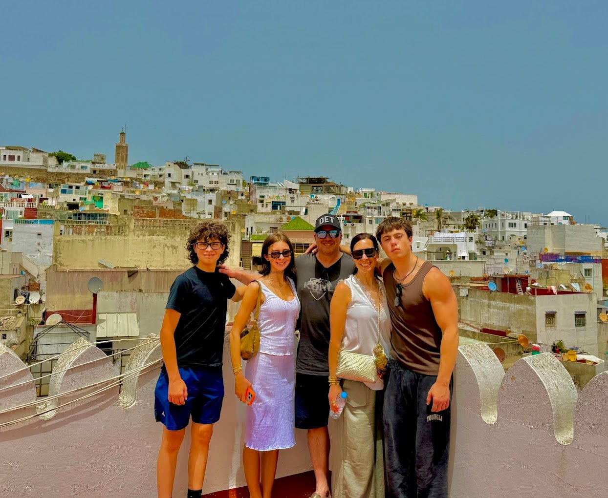 Travellers looking out over the rooftops of the Tangier Medina